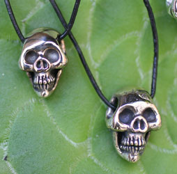Scull bronze pendants